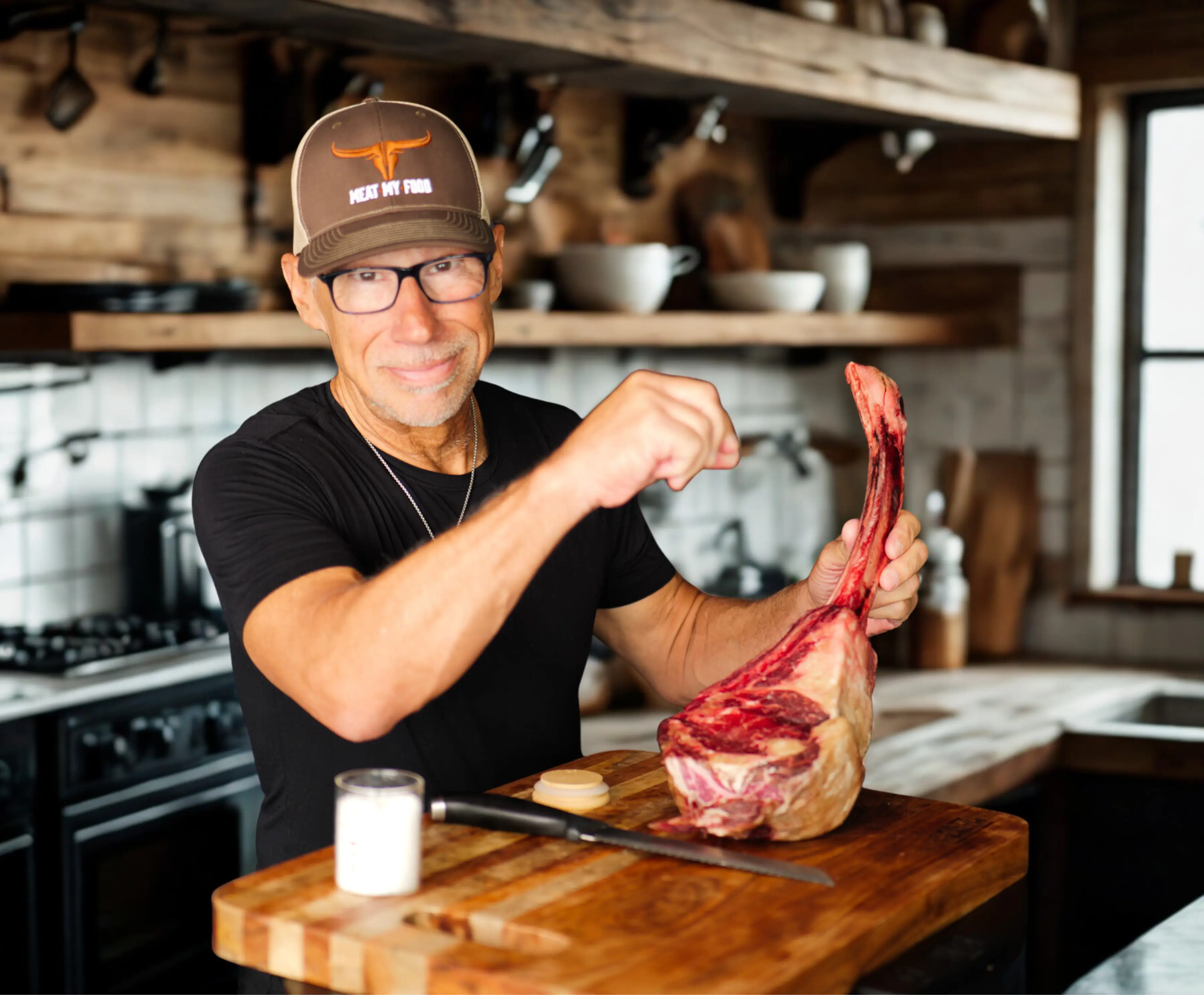 Dr. Kiltz holding a tomahawk steak, carnivore diet nutrition