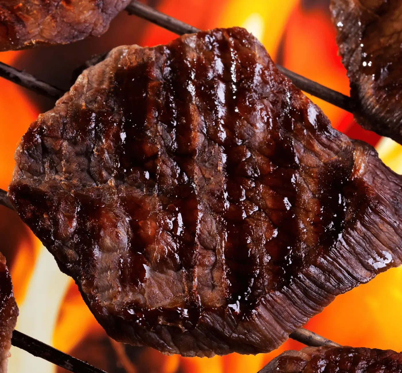 Flame-grilled steak closeup, high-fat keto carnivore meal